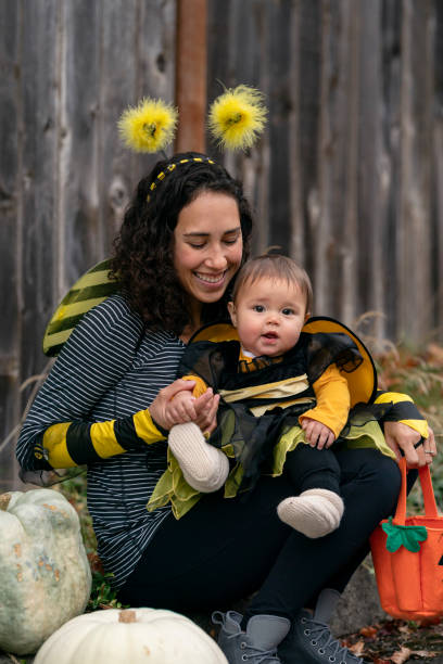 istock Adorable baby Trick or Treating with her mom 1326358531