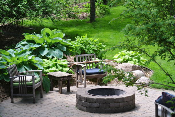 Backyard Firepit Fire pit in a quiet backyard garden feature stock pictures, royalty-free photos & images