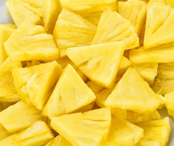 istock Slice of Pineapple on background 1326369726