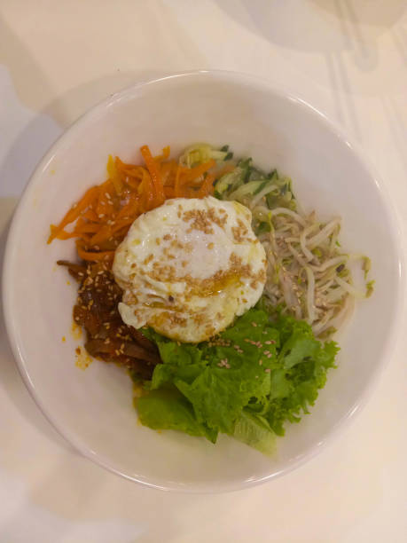 istock Bibimbap isolated on white background 1326373142