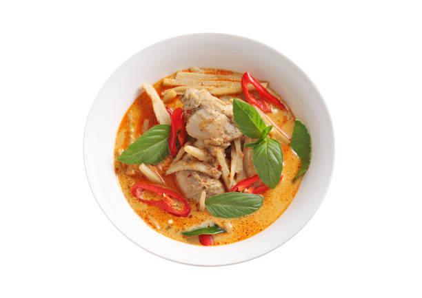 Thai chicken and bamboo shoot curry in ceramic bowl isolated on white background stock photo