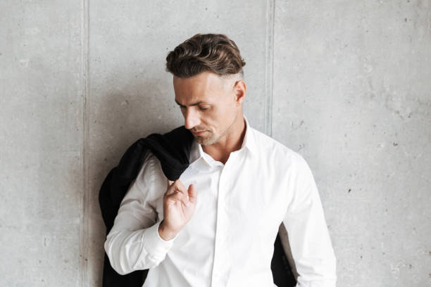 istock Attractive man with jacket over his shoulder 1326381383