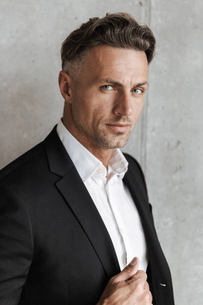 istock Close up portrait of a charming man dressed in suit 1326382130
