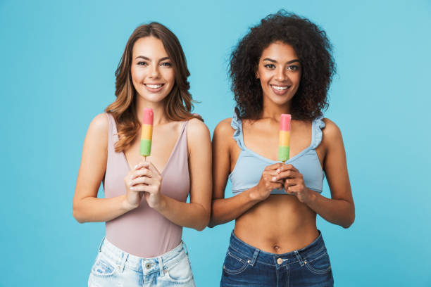istock Two happy young girls dressed in summer clothes 1326388701