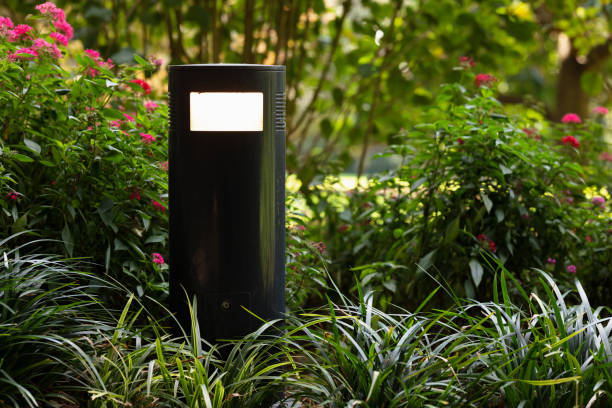 istock Lamp along a path in a public park 1326389848