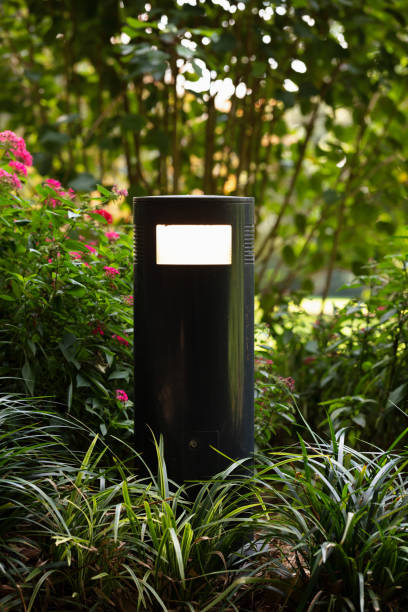 istock Lamp along a path in a public park 1326390663