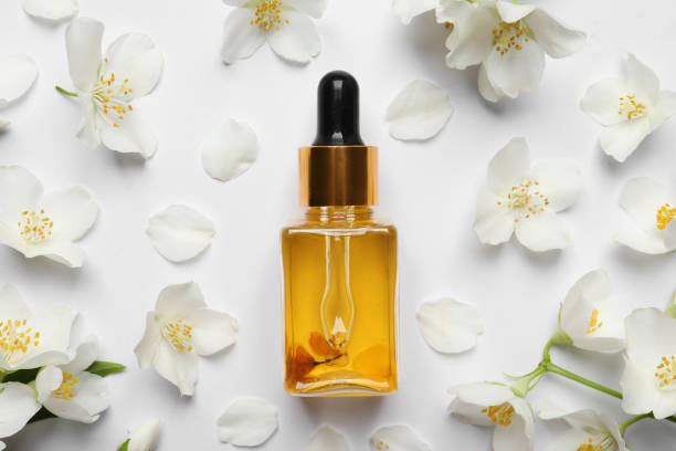 istock Jasmine essential and fresh flowers on white background, top view 1326392524