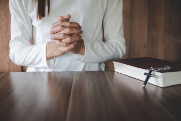 istock Human hands praying for blessings from god, Concept for Christian, Christianity, Catholic religion, divine, heavenly, celestial or god. 1326392864