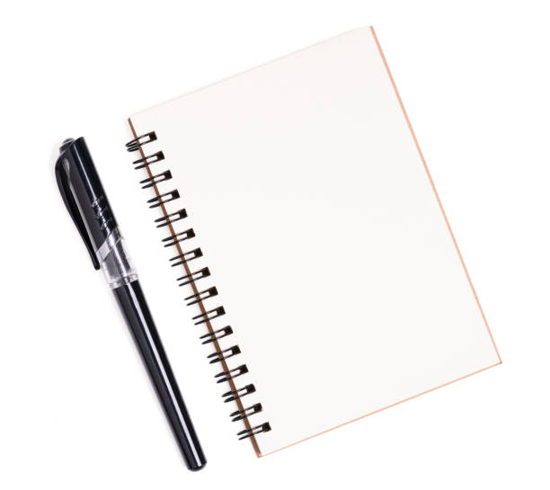 istock Isolated pen and notebook. Top view of spiral kraft notebook front, open page on background for mockup with clipping path. 1326393948