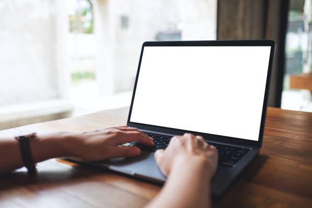 istock a woman using and typing on laptop computer with blank white desktop screen in cafe 1326394163