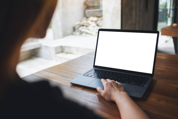 istock a woman using and touching on laptop touchpad with blank white desktop screen 1326394173