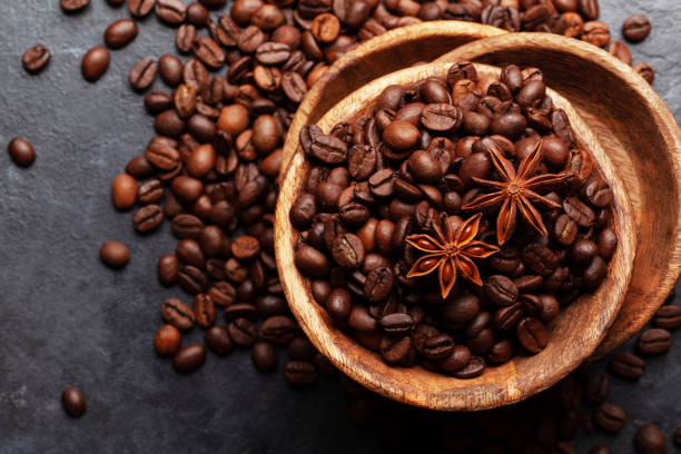 istock Roasted coffee beans in wooden bowl 1326398871
