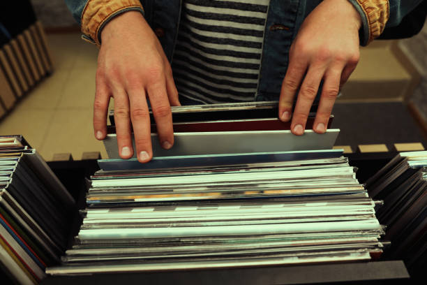 istock Man choosing vinyl records in store, closeup 1326399761