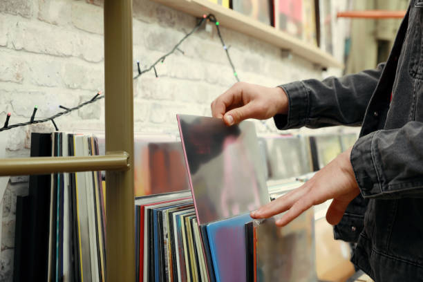 istock Man choosing vinyl records in store, closeup 1326400814