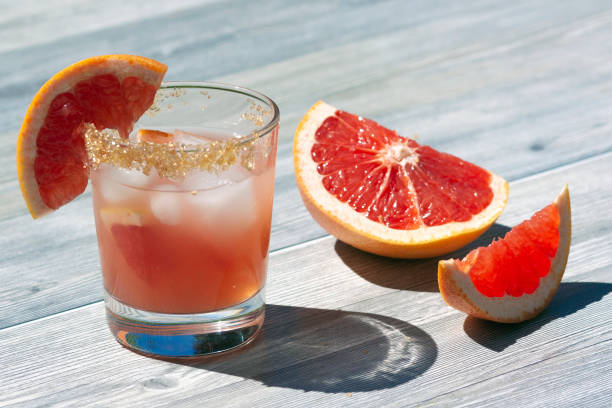 Grapefruit juice in a glass stock photo