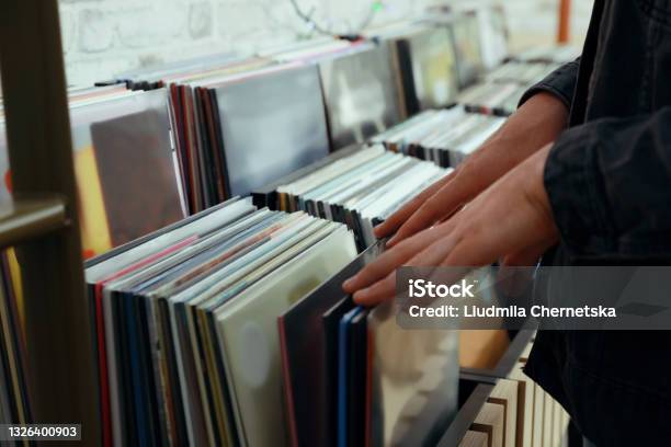 Man Choosing Vinyl Records In Store Closeup Stock Photo - Download Image Now - Record - Analog Audio, Shopping, Collection