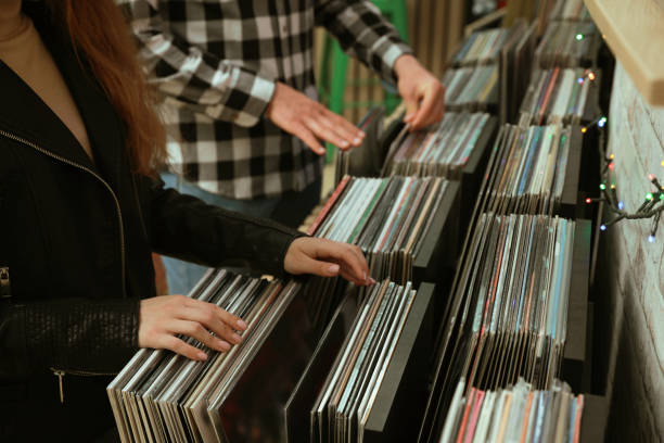 istock People choosing vinyl records in store, closeup 1326400909