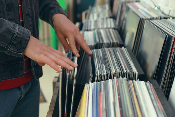 istock Man choosing vinyl records in store, closeup 1326400937