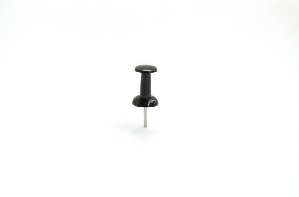 istock Stationery metal button with a black hat isolated on a white background 1326401018