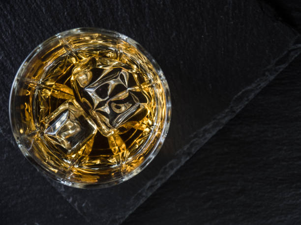 istock Whisky on the rocks on black slate 1326403244