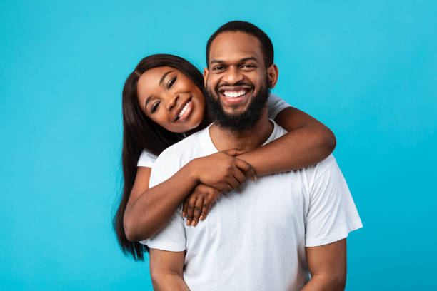 istock African American woman cuddling with her man 1326403341