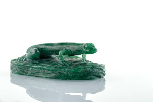 beautiful statuette of lizard salamander from malachite on a white background close-up