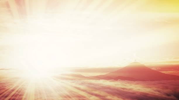 istock Golden sun rays and Mt. Fuji above the clouds 1326403415