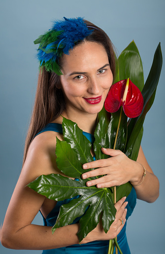 Woman holding fresh anthurium flower