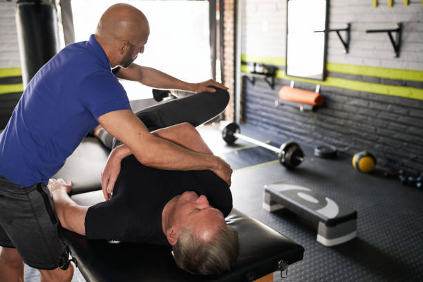 istock Physiotherapist stretching senior, elderly man, strength rehabilitation 1326403576