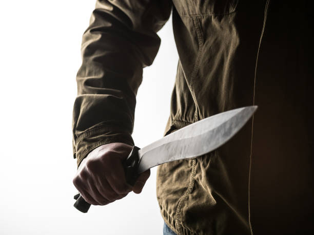 istock Man holding a machete in his hand 1326407172