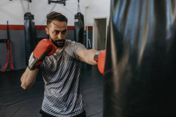 istock Male boxer training in gym 1326410379
