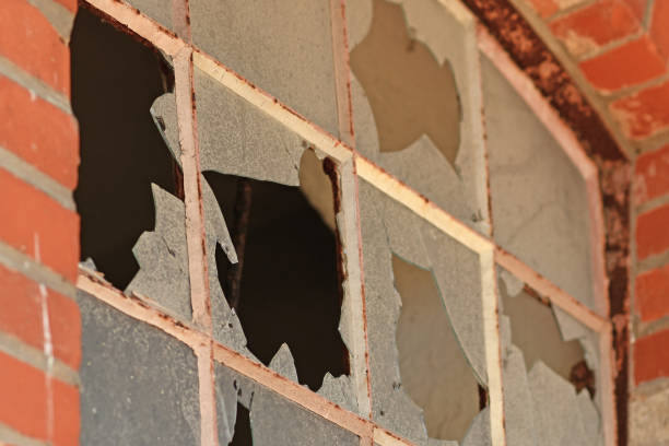 istock Close up of muntin window with broken glass 1326411206