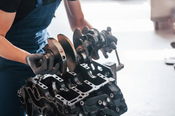 istock Professional repairman works with broken automobile engine 1326411531