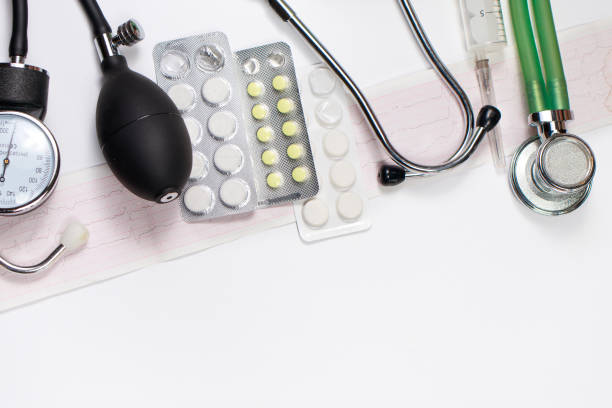 istock Medical instruments tonometer, phonendoscope, ECG and medicine with a place for text. 1326412611