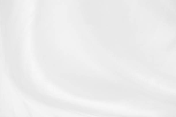 istock white cloth texture background with soft waves, crumpled fabric background 1326414820