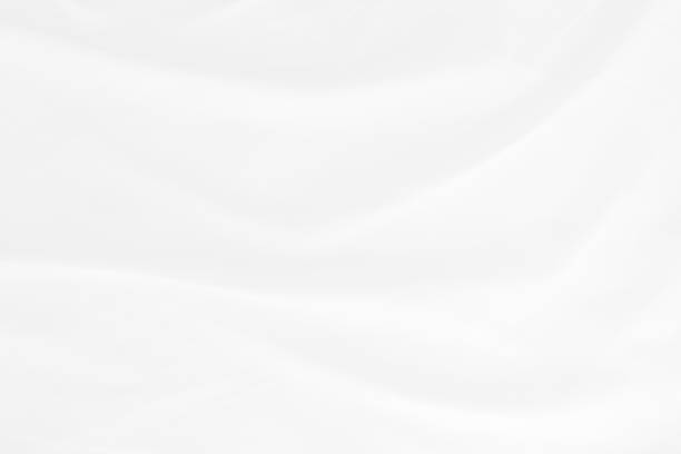 istock white cloth texture background with soft waves, crumpled fabric background 1326414823