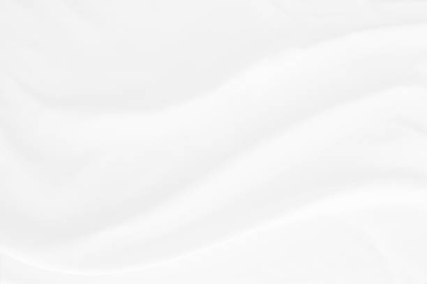 istock white cloth texture background with soft waves, crumpled fabric background 1326414838