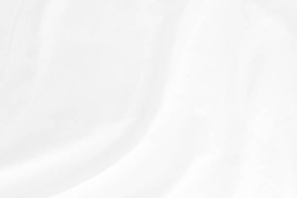istock white cloth texture background with soft waves, crumpled fabric background 1326414842