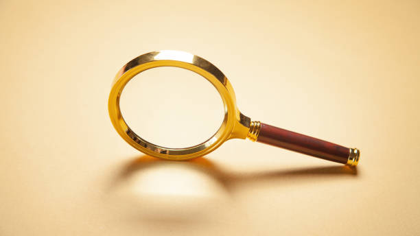 istock Magnifying glass on the yellow background. 1326415396