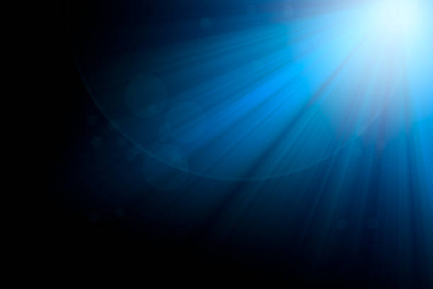 istock blue rays light and bokeh on black background for overlay design 1326416813