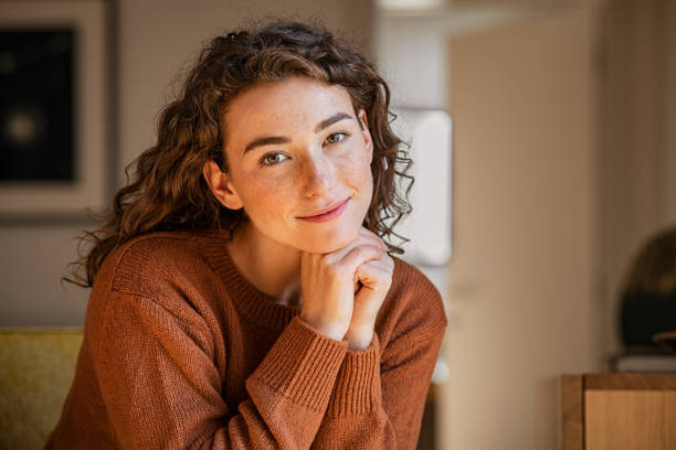 Serene young woman looking at camera