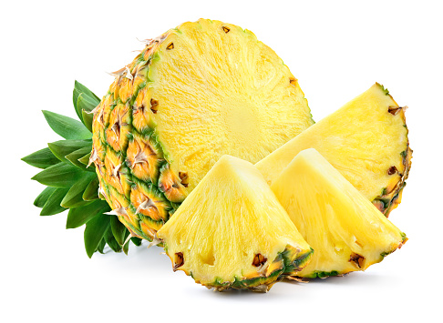 Cut pineapple isolated with slice, piece and leaves. Pineapples on white. Full depth of field.