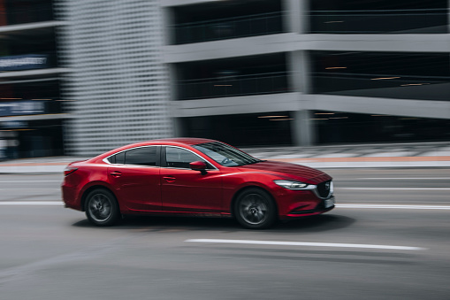 Ukraine, Kyiv - 27 June 2021: Red MAZDA 6 car moving on the street. Editorial