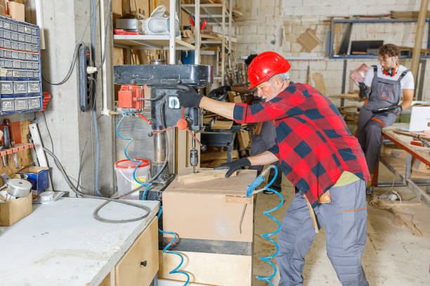istock A Small Group of Carpenters of Different Ethnicities are Working in Workshop. 1326423407