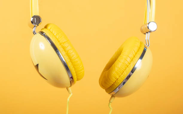 istock headphones on a yellow background 1326424618