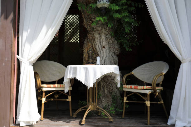 istock Table with chairs on veranda of cafe 1326424676
