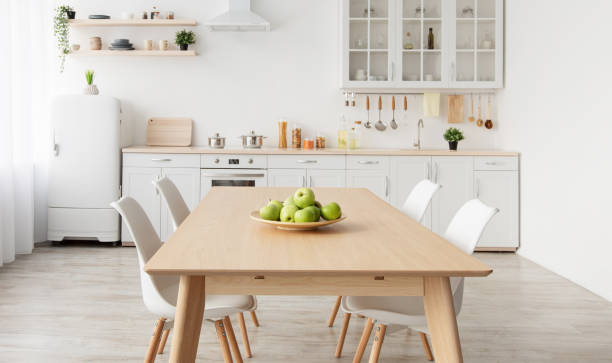 istock Modern scandinavian kitchen interior with various accessories. White kitchen furniture with household items on shelves 1326425121