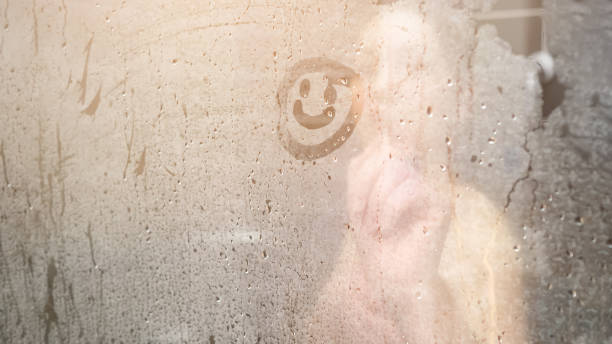istock blurry naked lady draws smile on white condensate close 1326427337