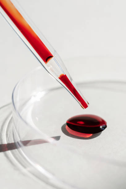 istock The hand holds a test tube with blood. 1326427461