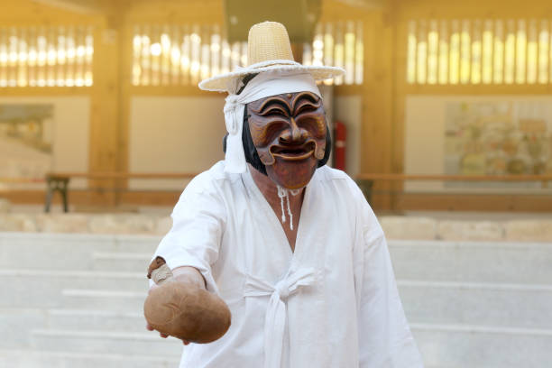 October 17, 2015 Andong City, Gyeongsangbuk-do, Korea.A mask of the Seonang Gut that the awakening pants play in the process of byeolsingut.The man in the photo is a butcher selling cow balls.